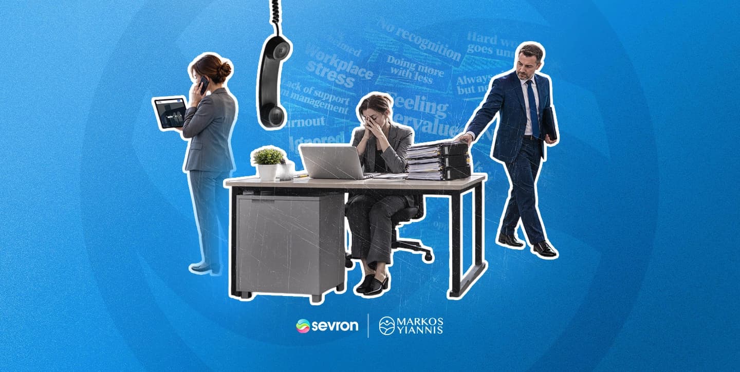 An employee sitting apart from colleagues at work, representing unseen effort and the psychosocial hazard of feeling undervalued.